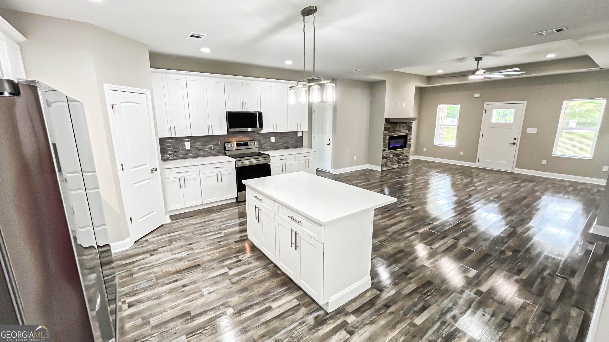 2011 Griffin Road Macon, GA 31216 - Photo 52 of 64 a kitchen with a sink a counter top space stainless steel appliances and cabinets