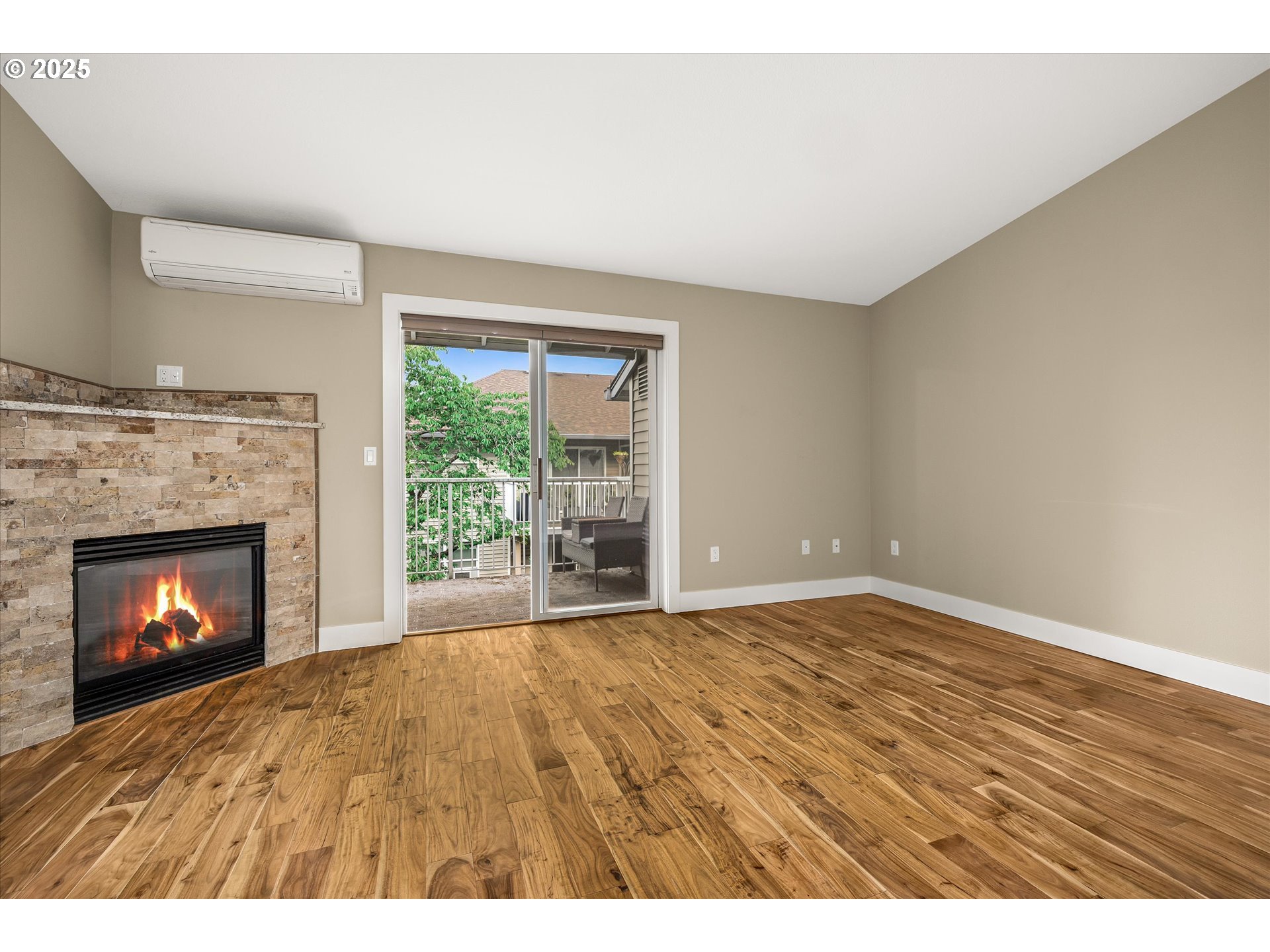 4686 West Powell Boulevard, Unit 241 Gresham, OR 97030 - Photo 14 of 44 a view of an empty room with a fireplace