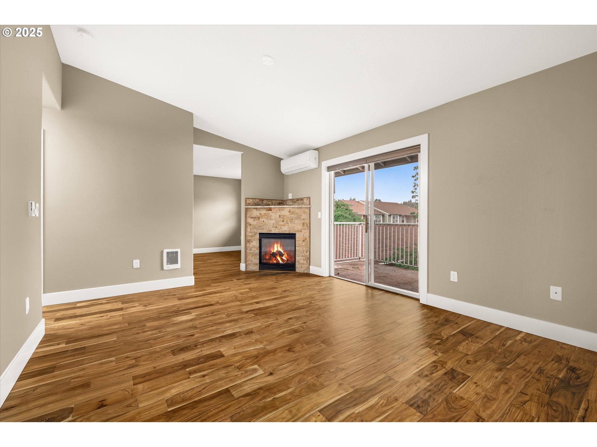 4686 West Powell Boulevard, Unit 241 Gresham, OR 97030 - Photo 15 of 44 a view of an empty room with a fireplace and a window