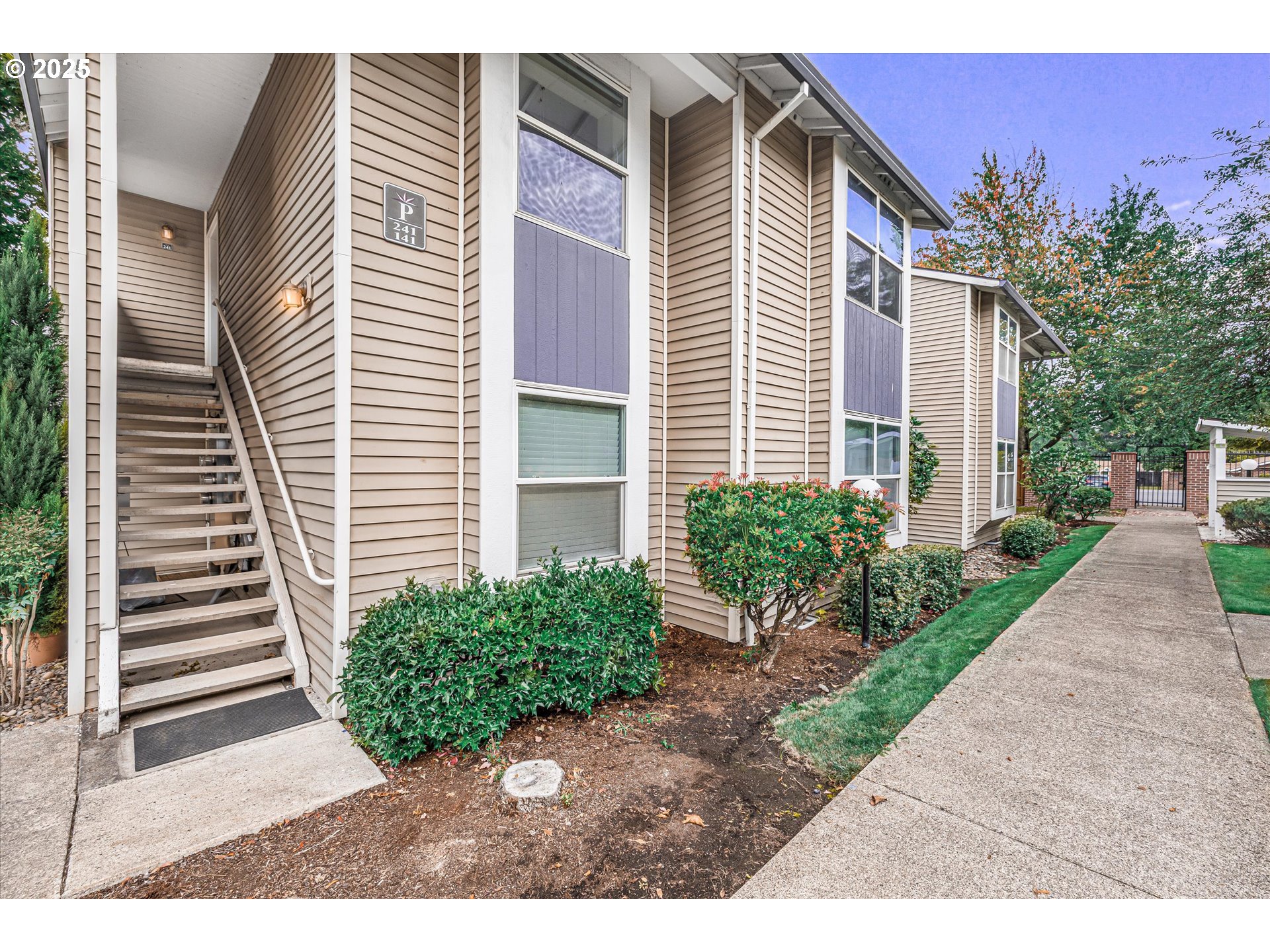 4686 West Powell Boulevard, Unit 241 Gresham, OR 97030 - Photo 2 of 44 a view of a house with a yard