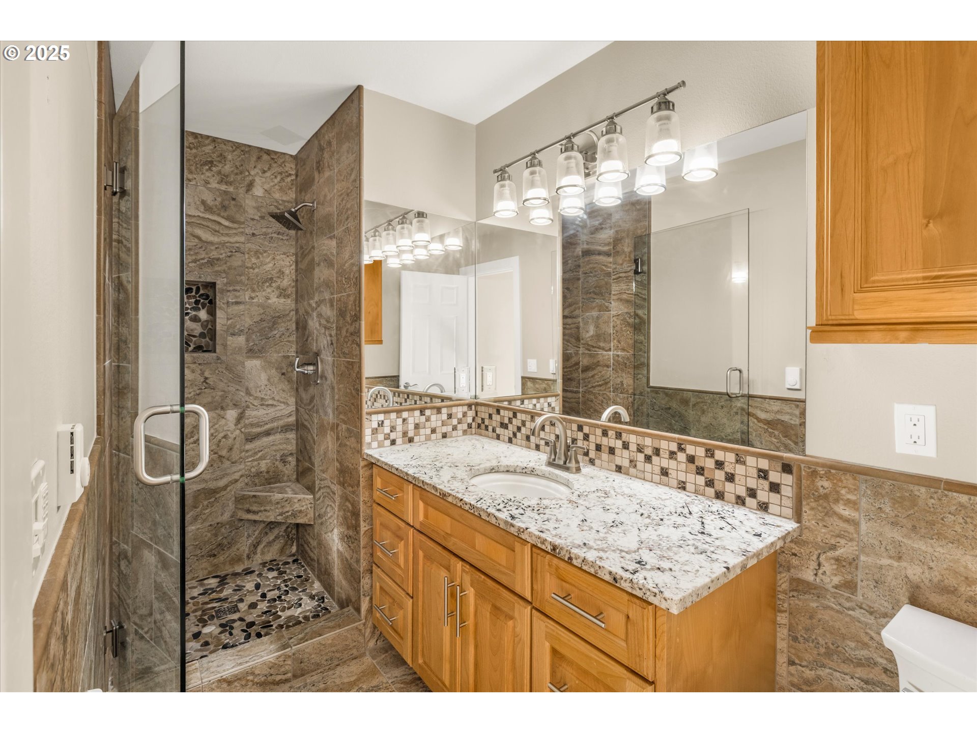 4686 West Powell Boulevard, Unit 241 Gresham, OR 97030 - Photo 21 of 44 a bathroom with a sink vanity granite and a shower