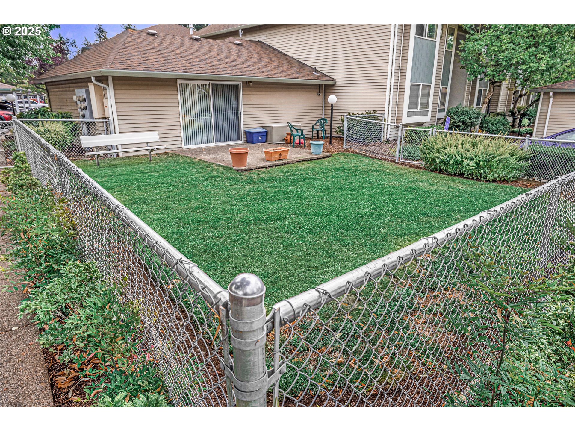 4686 West Powell Boulevard, Unit 241 Gresham, OR 97030 - Photo 33 of 44 a front view of a house with a garden and plants