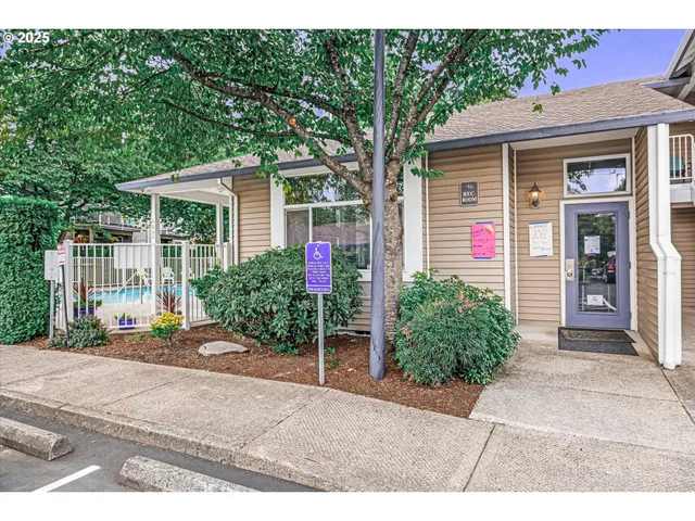 a living room with furniture and a chair