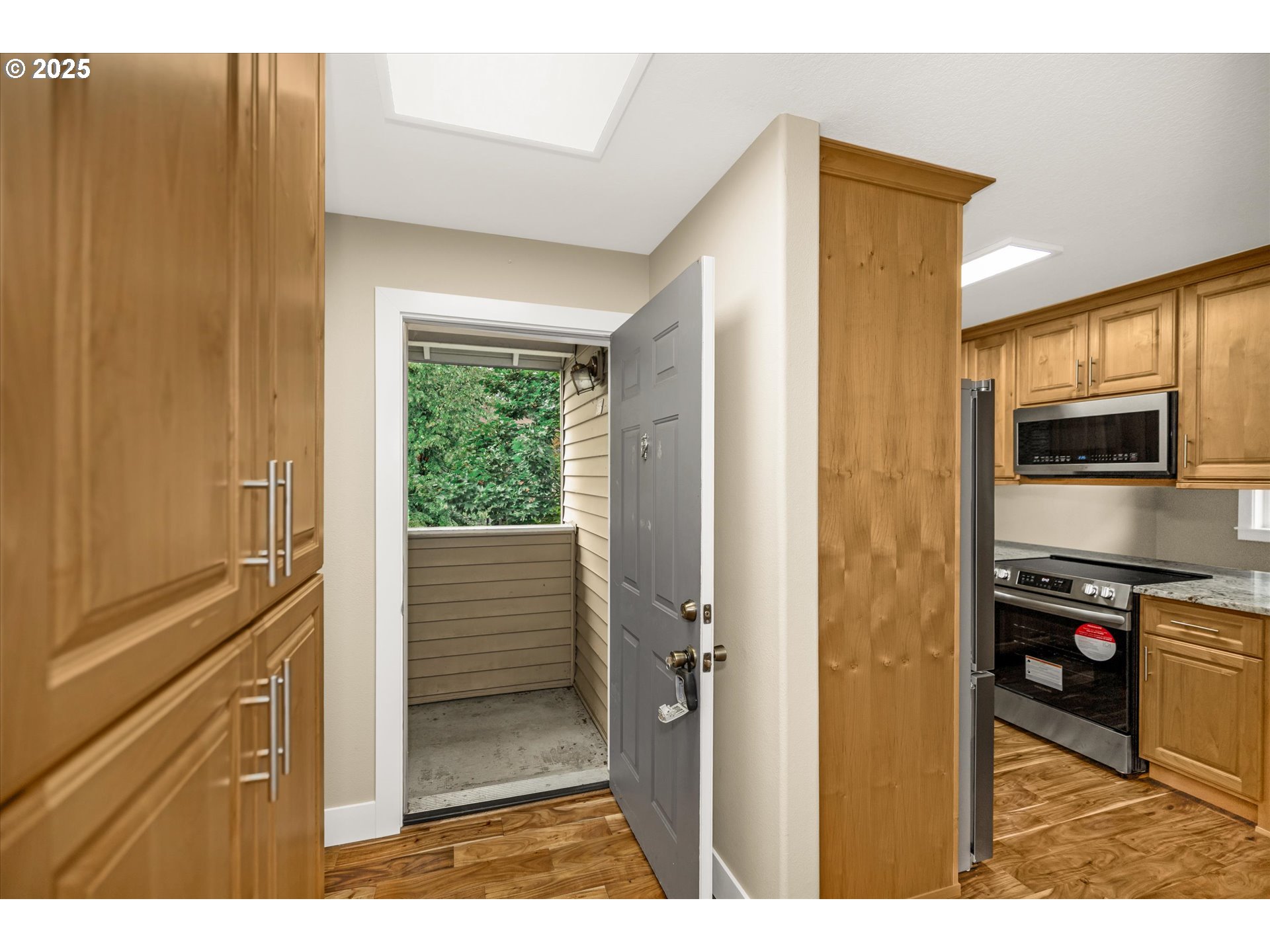 4686 West Powell Boulevard, Unit 241 Gresham, OR 97030 - Photo 4 of 44 a view of a kitchen from the hallway