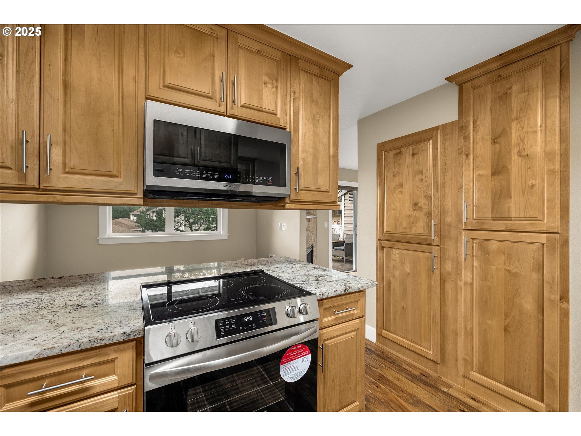 4686 West Powell Boulevard, Unit 241 Gresham, OR 97030 - Photo 7 of 44 a kitchen with granite countertop cabinets stainless steel appliances and a counter space