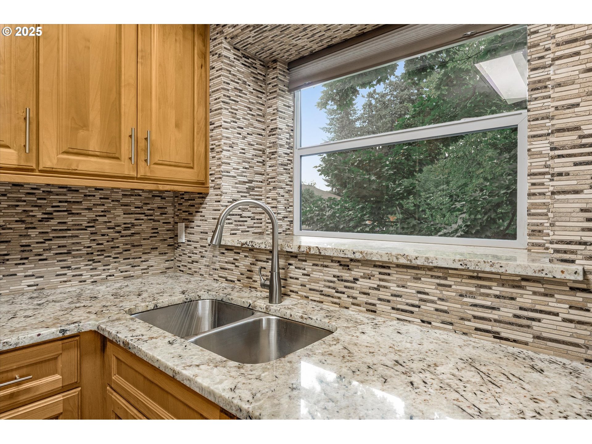 4686 West Powell Boulevard, Unit 241 Gresham, OR 97030 - Photo 8 of 44 a kitchen with a sink and wooden cabinets
