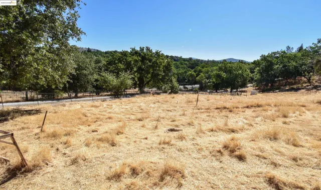 a view of a yard covered with snow in the background