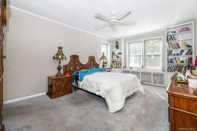 a bed room with a bed and a chair