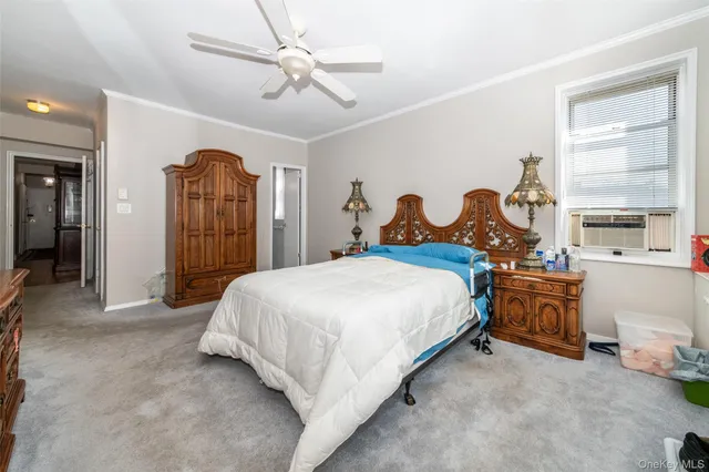 a bed room with a bed and a chandelier