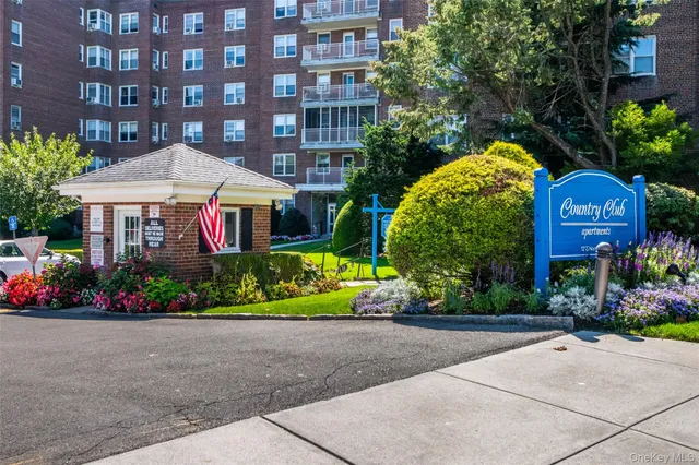 a front view of a building with garden