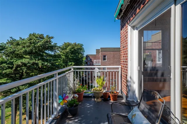 a view of a balcony with chairs