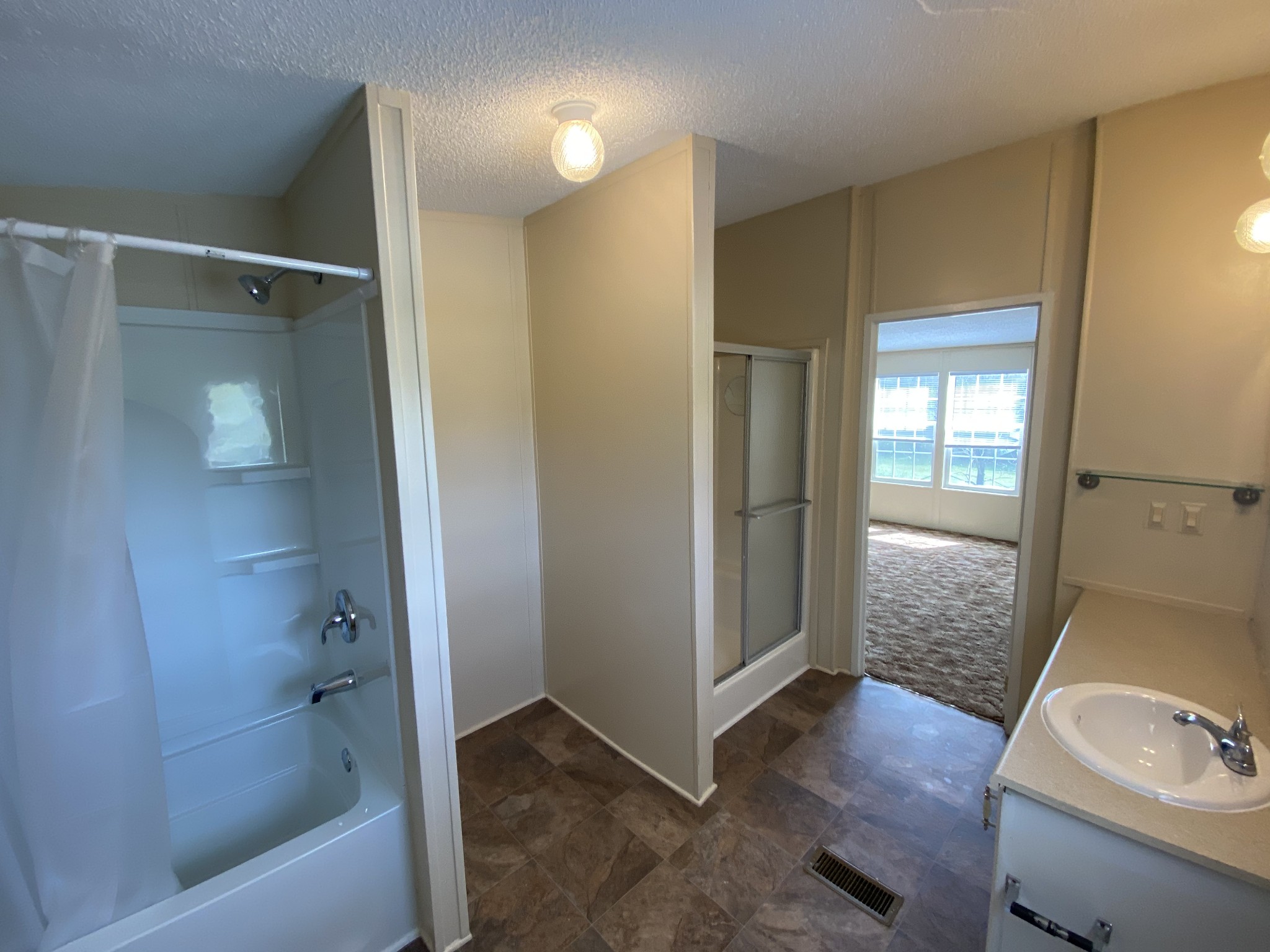3200 Beasleys Bend Road Lebanon, TN 37087 - Photo 13 of 19 a bathroom with a tub shower vanity and a sink