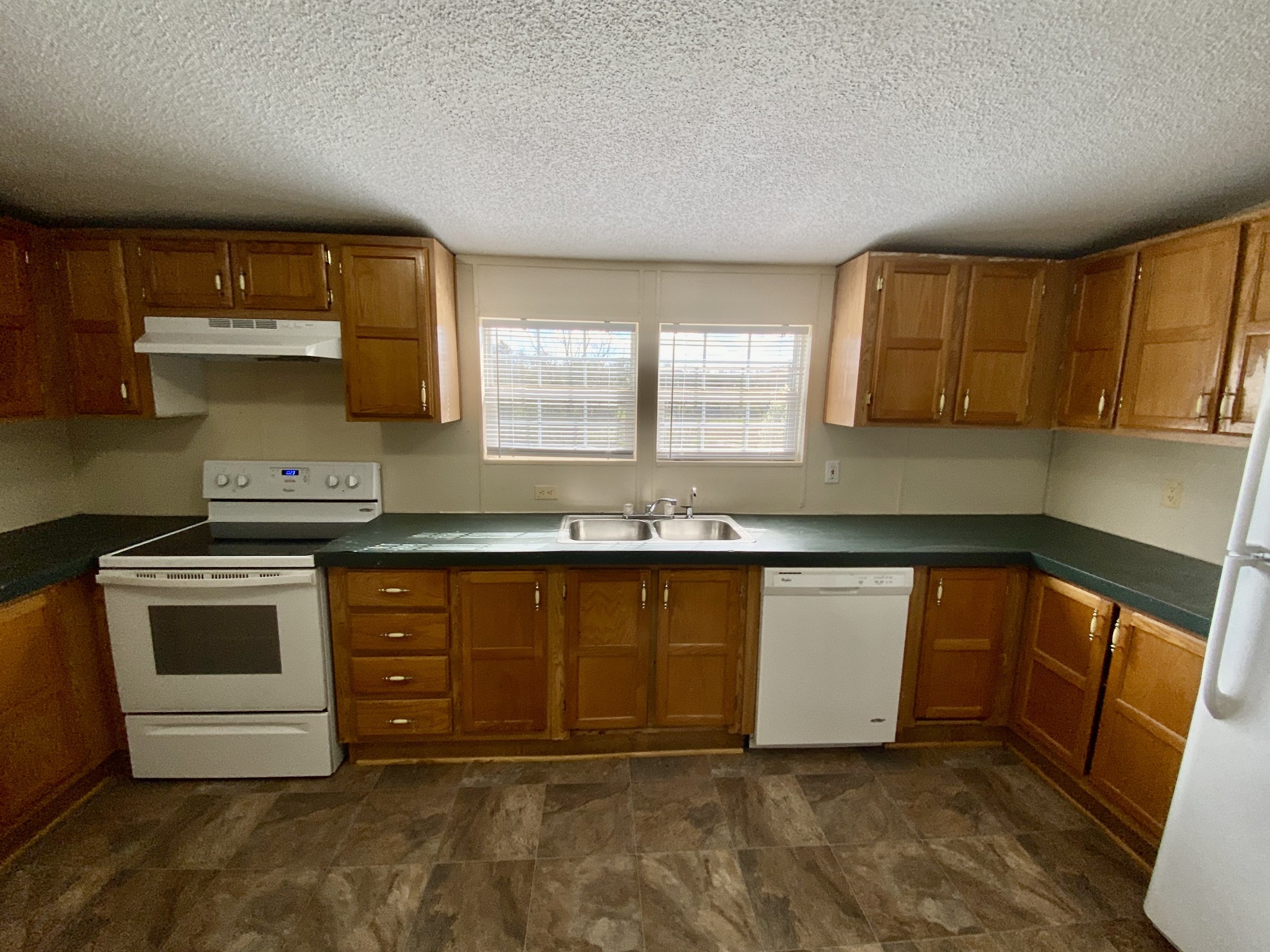 3200 Beasleys Bend Road Lebanon, TN 37087 - Photo 8 of 19 a kitchen with stainless steel appliances granite countertop a stove a sink and a microwave