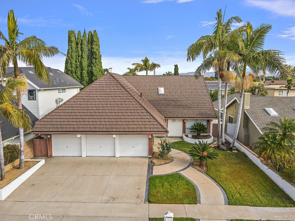 a aerial view of a house with garden space and plants