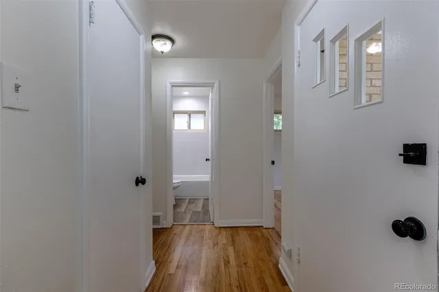 a bathroom with a sink and mirror with toilet