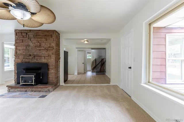 a view of an empty room and fire place