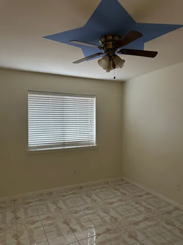 a view of a room that has a window in it