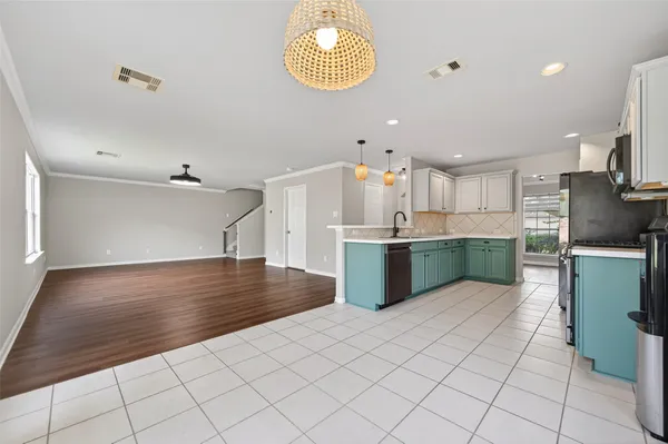 a view of kitchen with granite countertop window and a sink
