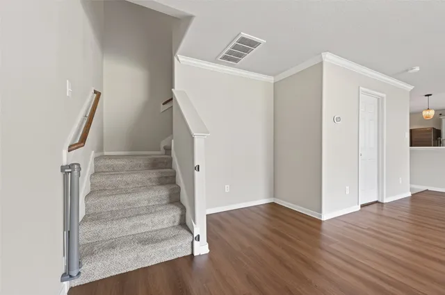 a view of entryway with wooden floor