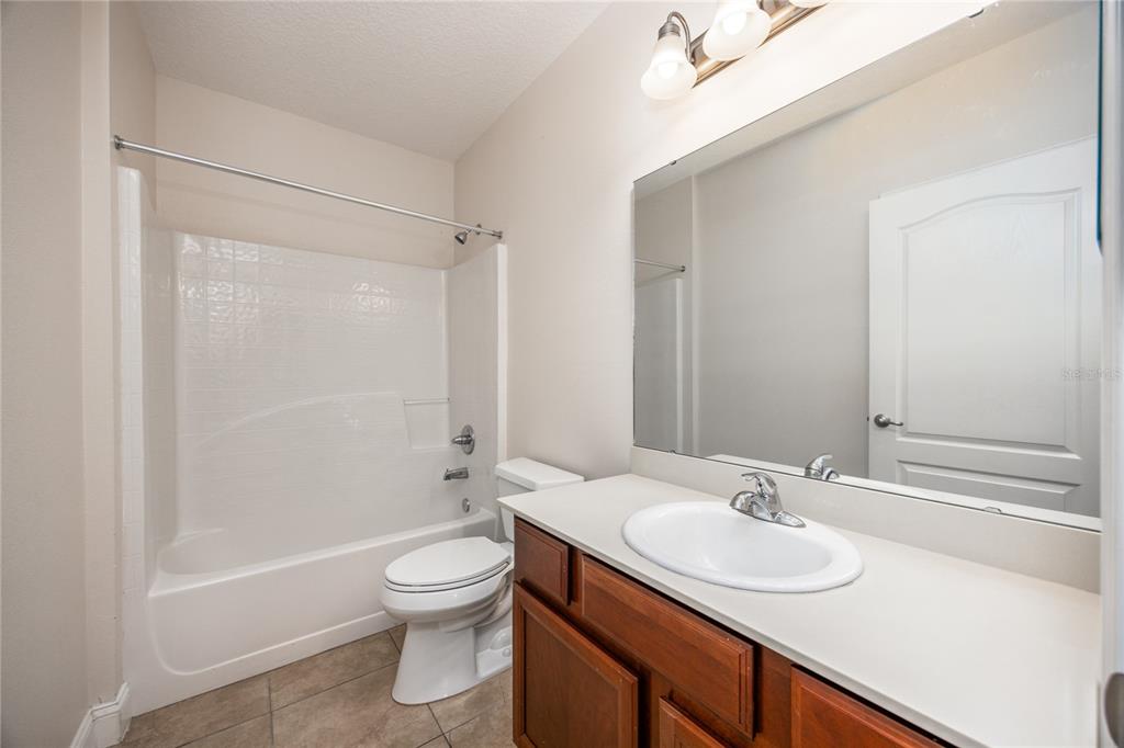 8216 Northwest 54th Street Gainesville, FL 32653 - Photo 16 of 58 a bathroom with a sink toilet tub and shower