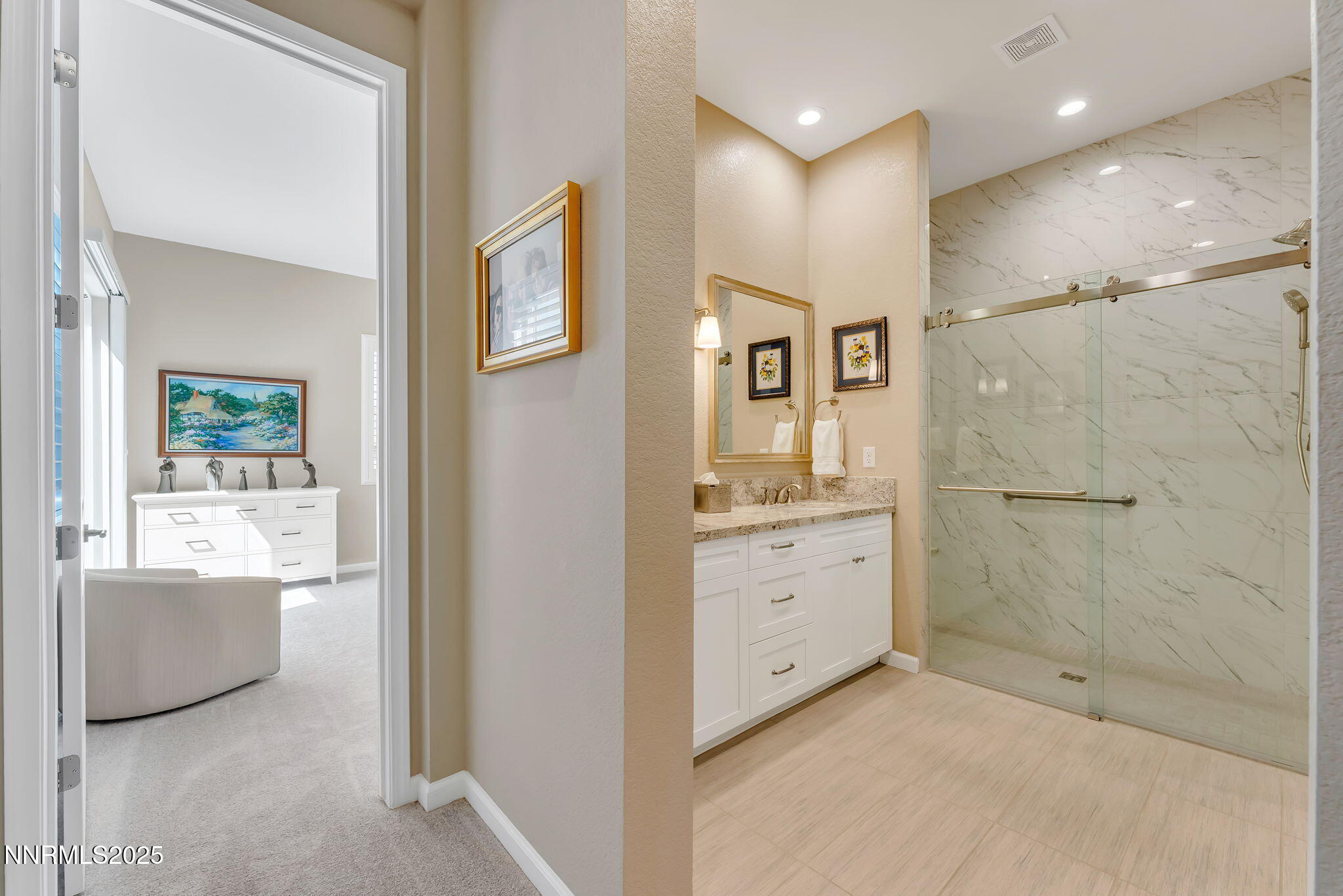 2121 Kate's Bridge Drive Reno, NV 89521 - Photo 17 of 35 a bathroom with a granite countertop sink a mirror bathtub and shower