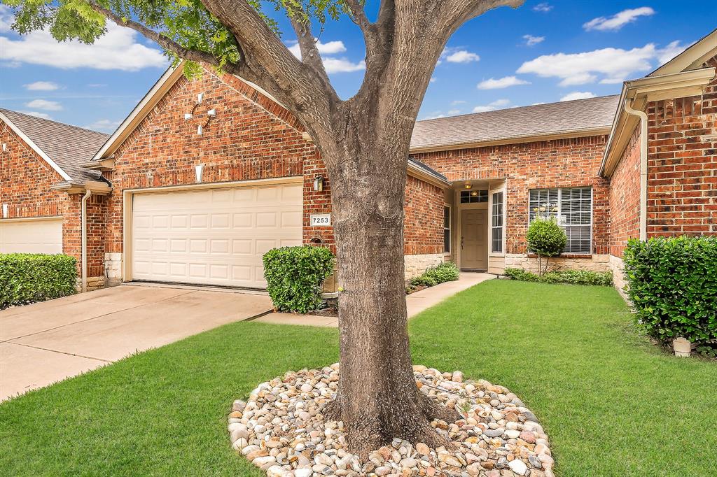 7253 Bianca Lane Plano, TX 75093 - Photo 1 of 18 a front view of a house with garden