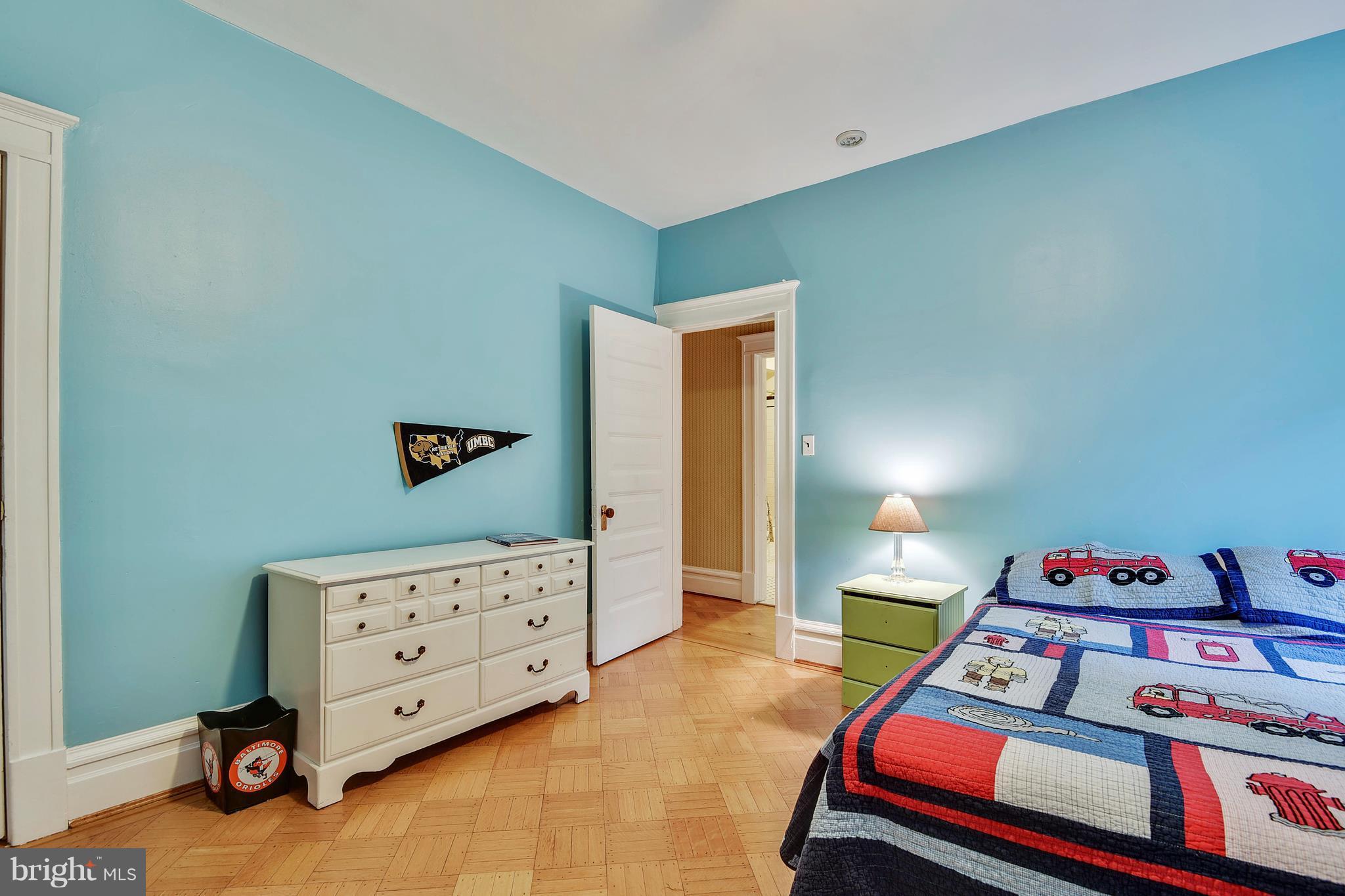 501 Hawthorn Road Baltimore, MD 21210 - Photo 15 of 30 a bedroom with a bed and a dresser in it