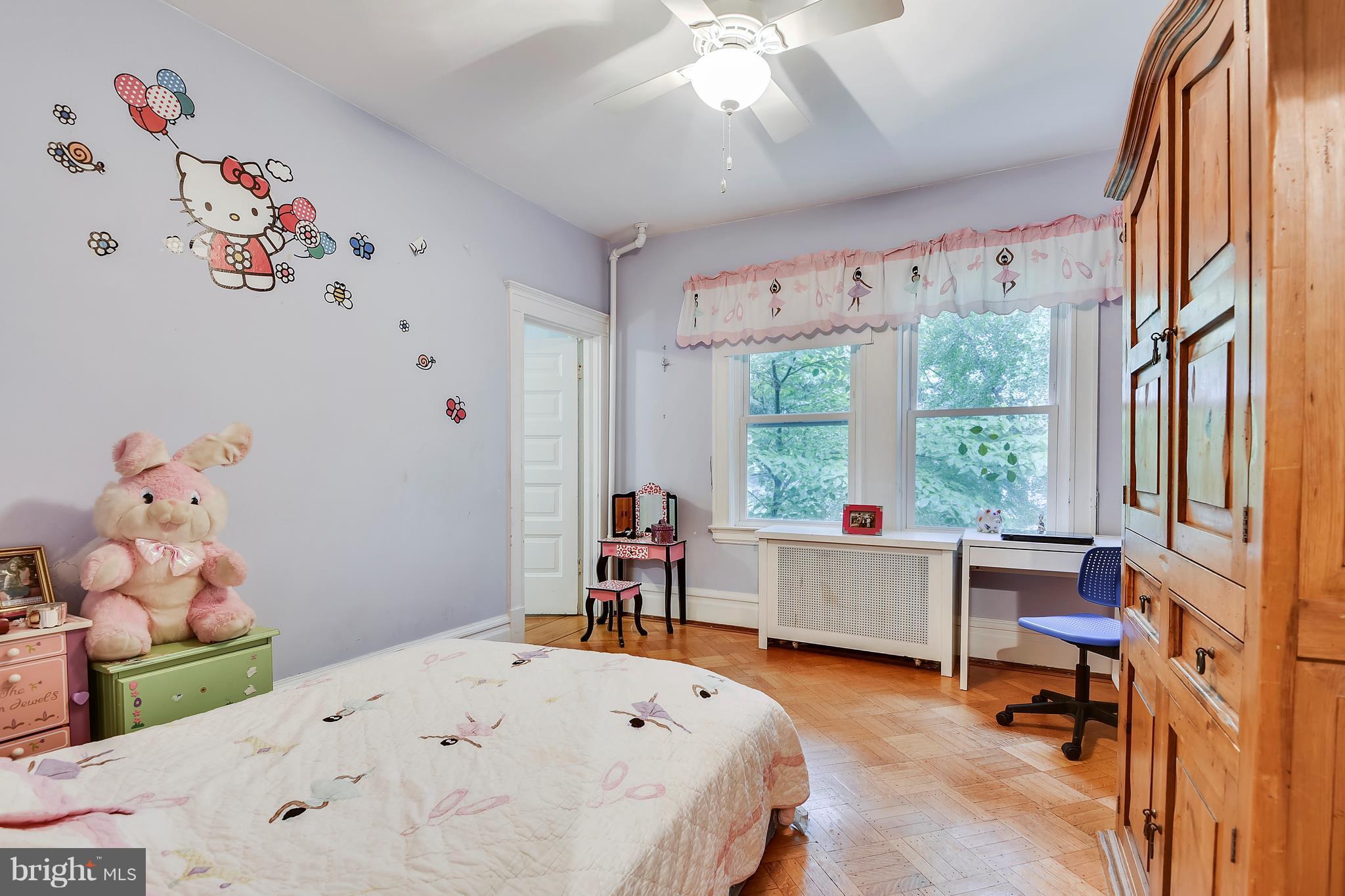 501 Hawthorn Road Baltimore, MD 21210 - Photo 18 of 30 a bed room with a bed and a chair