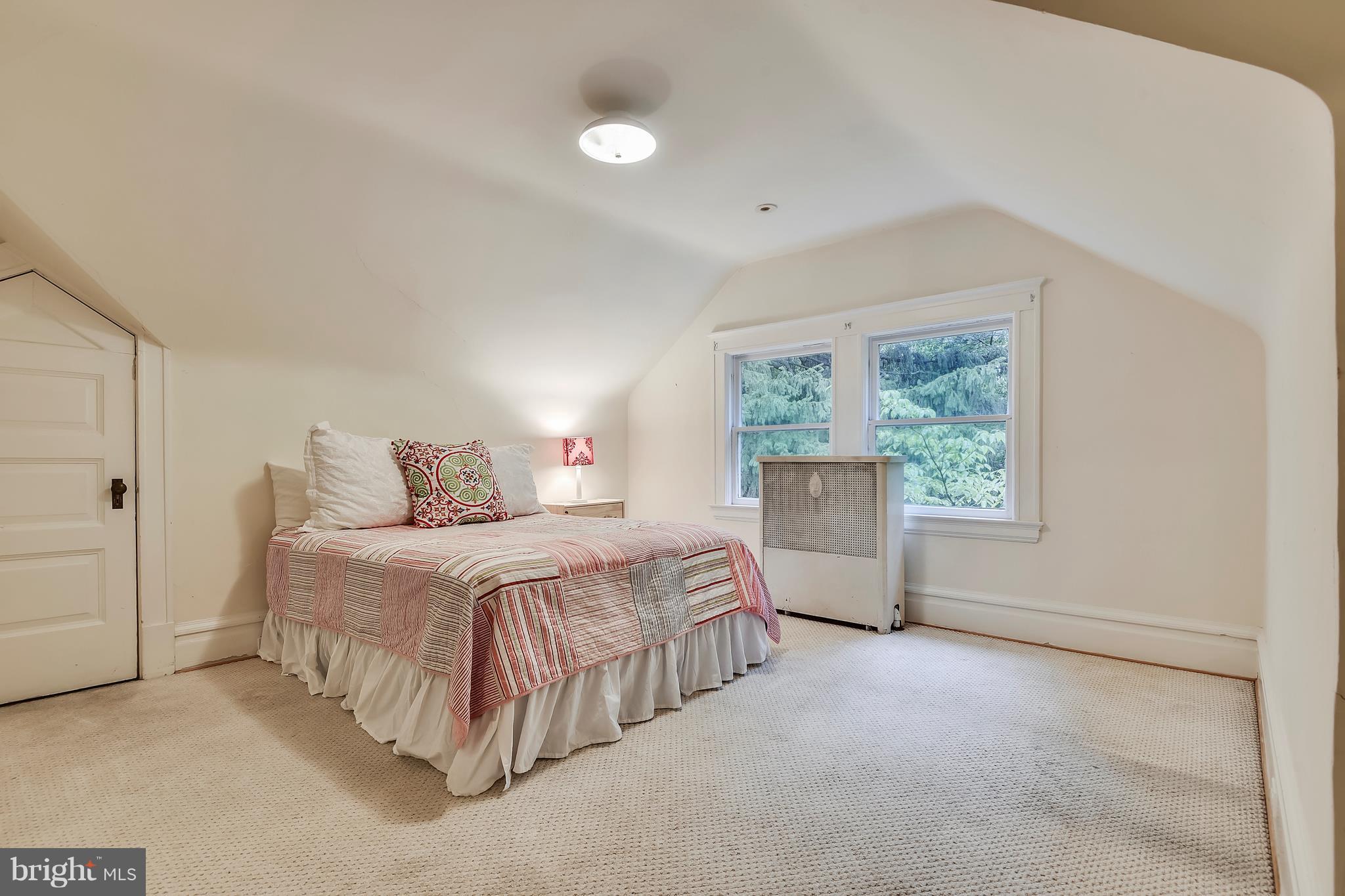 501 Hawthorn Road Baltimore, MD 21210 - Photo 21 of 30 a spacious bedroom with a bed and a window