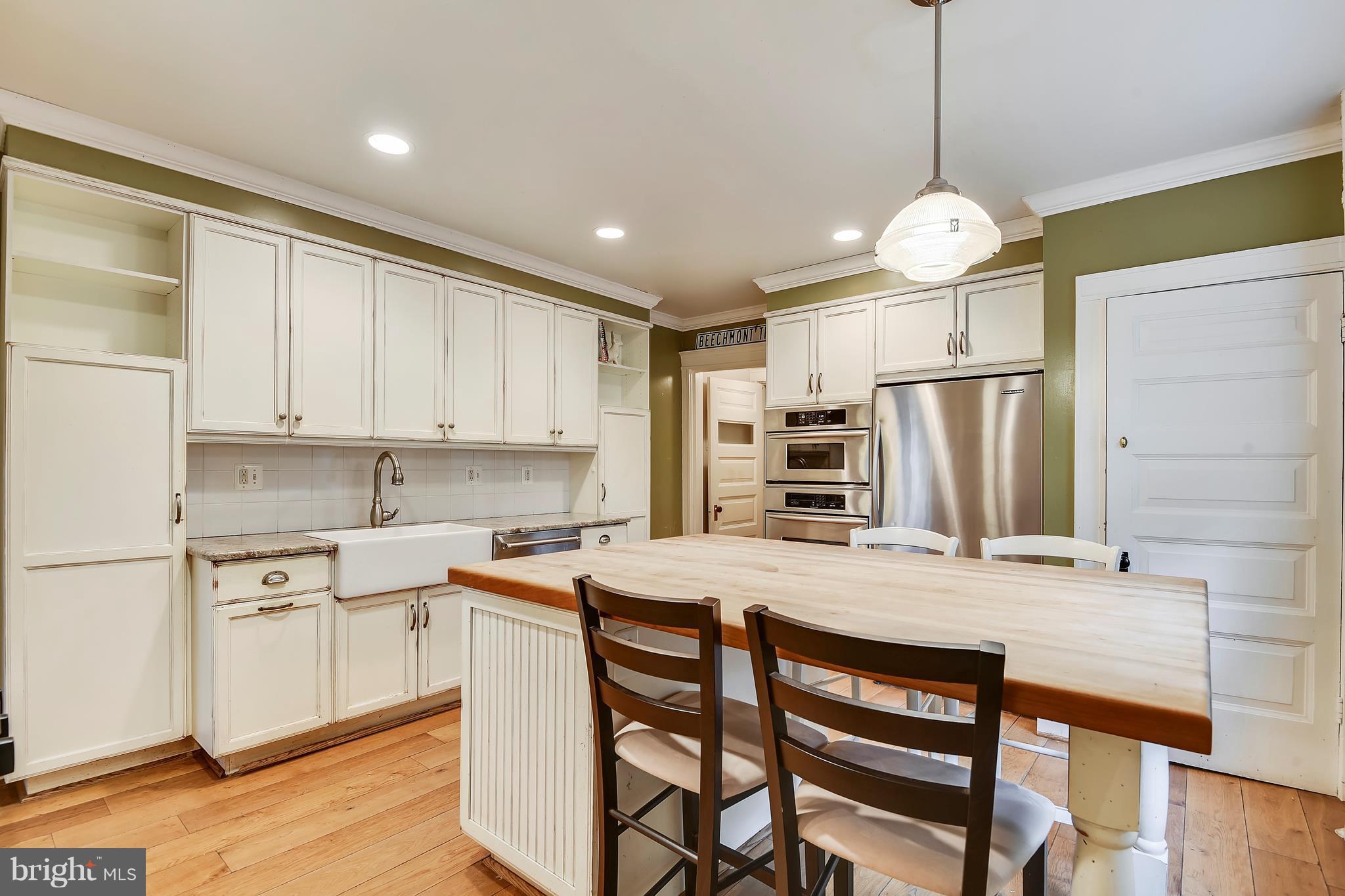 501 Hawthorn Road Baltimore, MD 21210 - Photo 5 of 30 a kitchen with a center island and stainless steel appliances