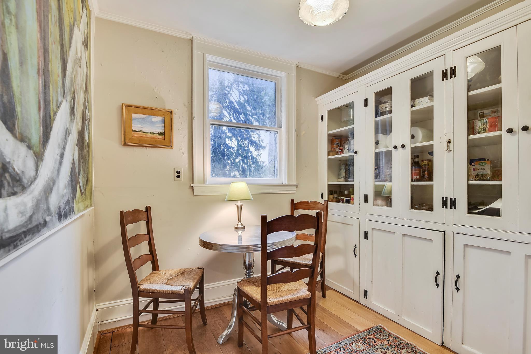 501 Hawthorn Road Baltimore, MD 21210 - Photo 6 of 30 a view of a dining room with furniture and a window