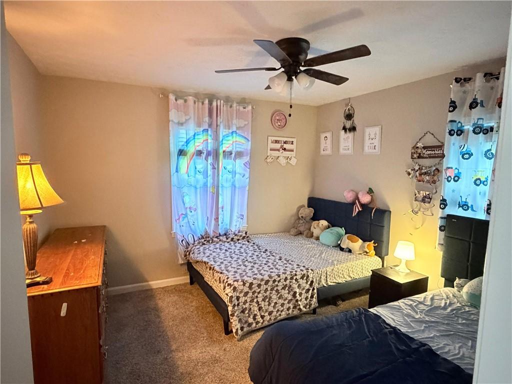 3002 Jennings Court Powder Springs, GA 30127 - Photo 16 of 47 a bedroom with a bed and a window
