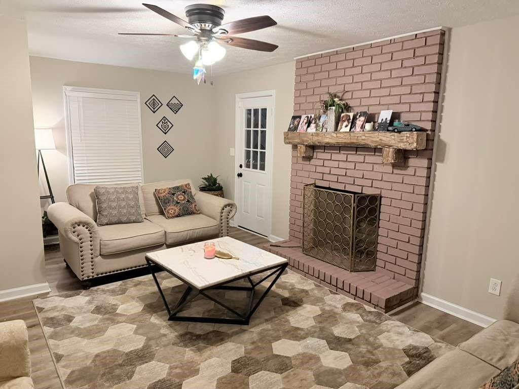 3002 Jennings Court Powder Springs, GA 30127 - Photo 18 of 47 a living room with furniture and a fireplace