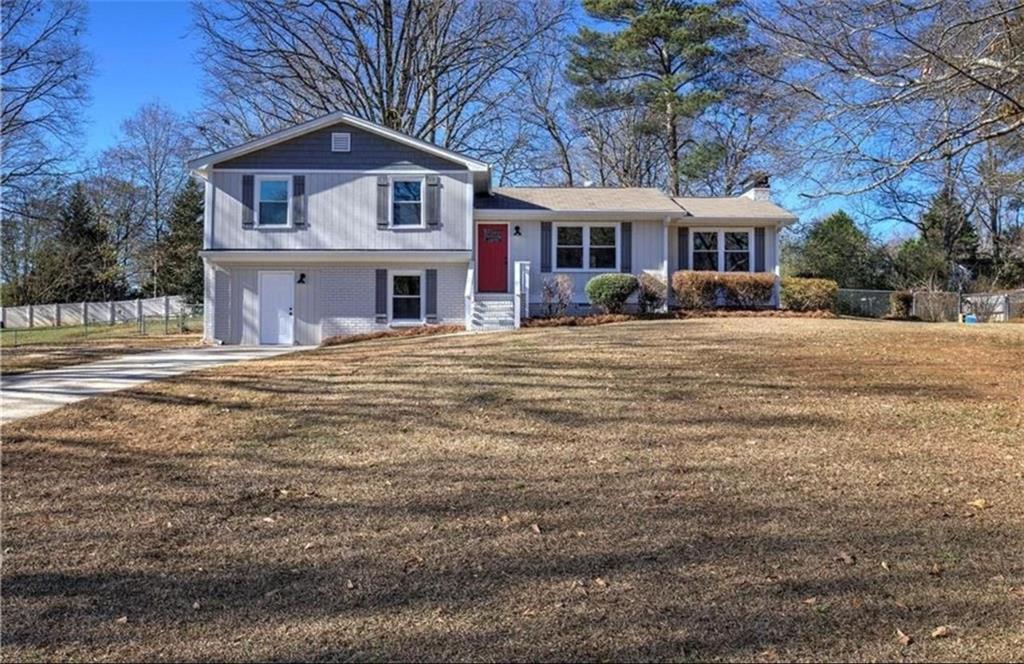 3002 Jennings Court Powder Springs, GA 30127 - Photo 2 of 47 a front view of a house with a yard
