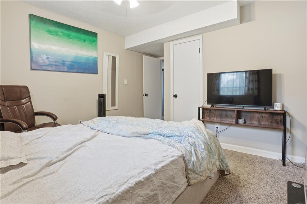 3002 Jennings Court Powder Springs, GA 30127 - Photo 24 of 47 a bedroom with bed and tv