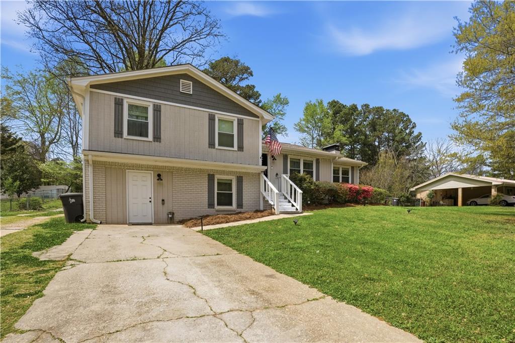 3002 Jennings Court Powder Springs, GA 30127 - Photo 25 of 47 a front view of a house with a garden