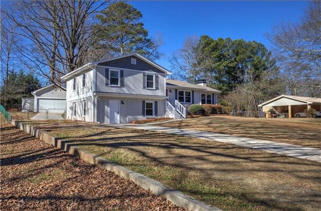 3002 Jennings Court Powder Springs, GA 30127 - Photo 3 of 47 a front view of a house with a yard