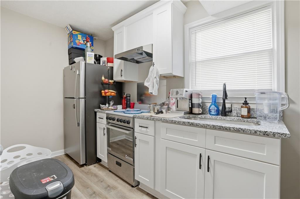 3002 Jennings Court Powder Springs, GA 30127 - Photo 31 of 47 a kitchen with sink cabinets and window