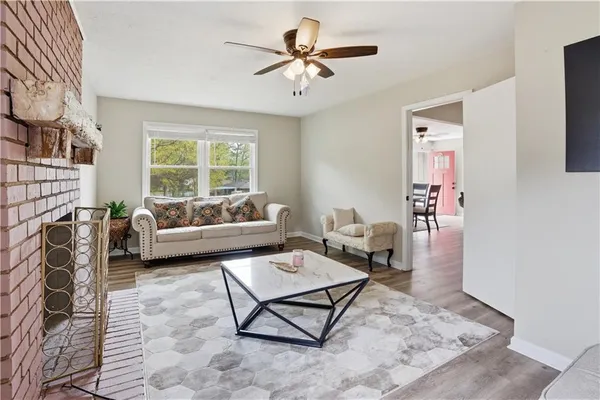 a living room with furniture and a rug