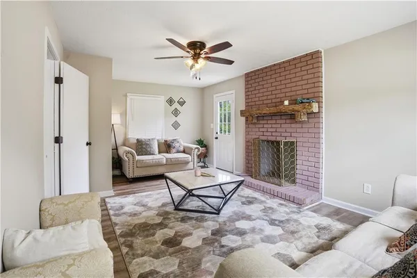 a living room with furniture and a fireplace