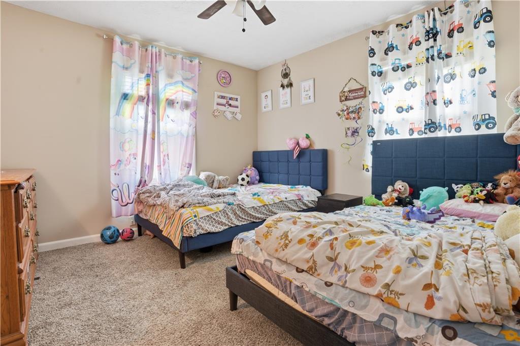 3002 Jennings Court Powder Springs, GA 30127 - Photo 38 of 47 a bedroom with two beds and painted walls