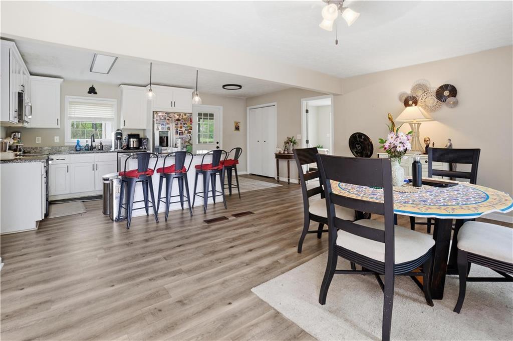 3002 Jennings Court Powder Springs, GA 30127 - Photo 39 of 47 a view of a dining room with furniture and wooden floor