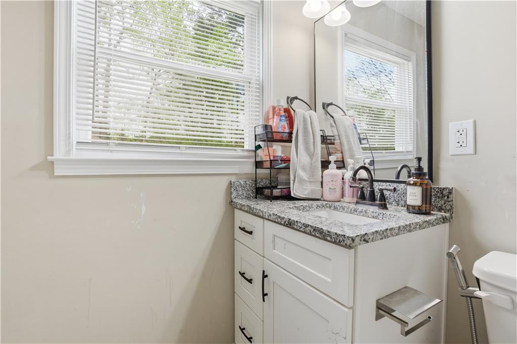 3002 Jennings Court Powder Springs, GA 30127 - Photo 40 of 47 a bathroom with a granite countertop sink and a window