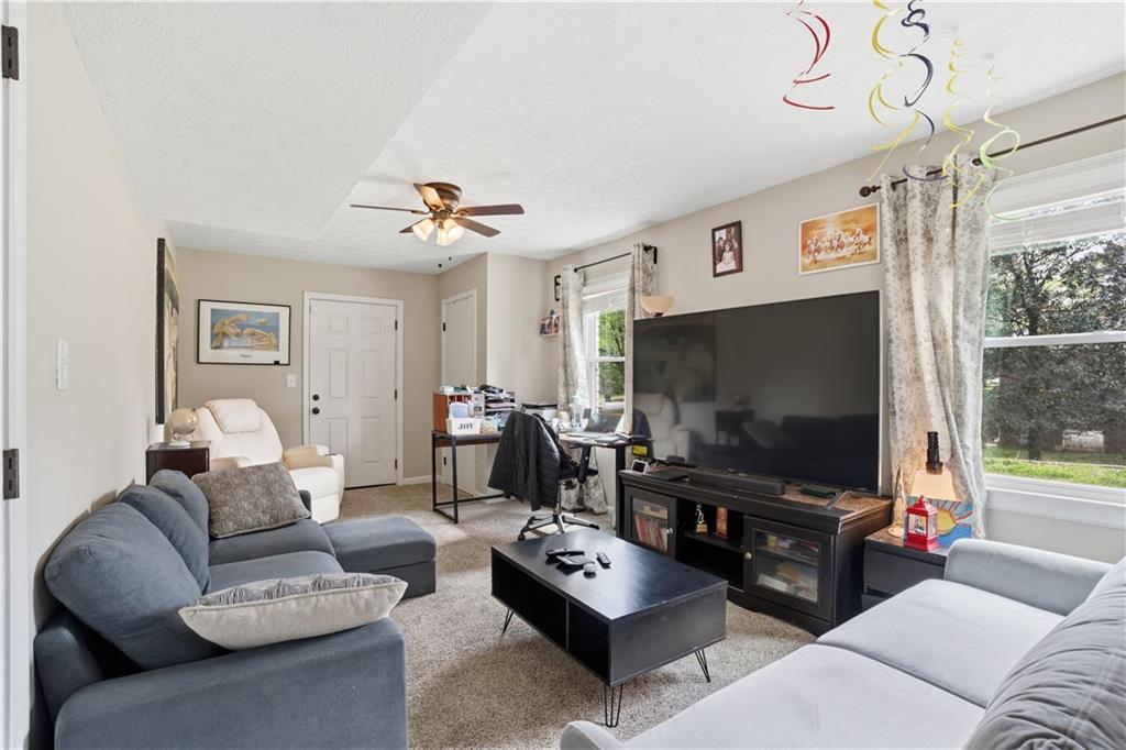 3002 Jennings Court Powder Springs, GA 30127 - Photo 41 of 47 a living room with furniture and a flat screen tv