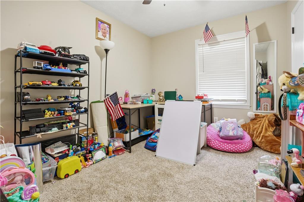 3002 Jennings Court Powder Springs, GA 30127 - Photo 43 of 47 a view of walk in closet with clothes and shoes