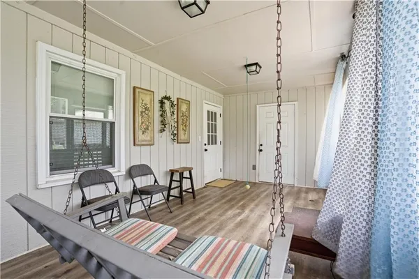 a living room with furniture a window and a table