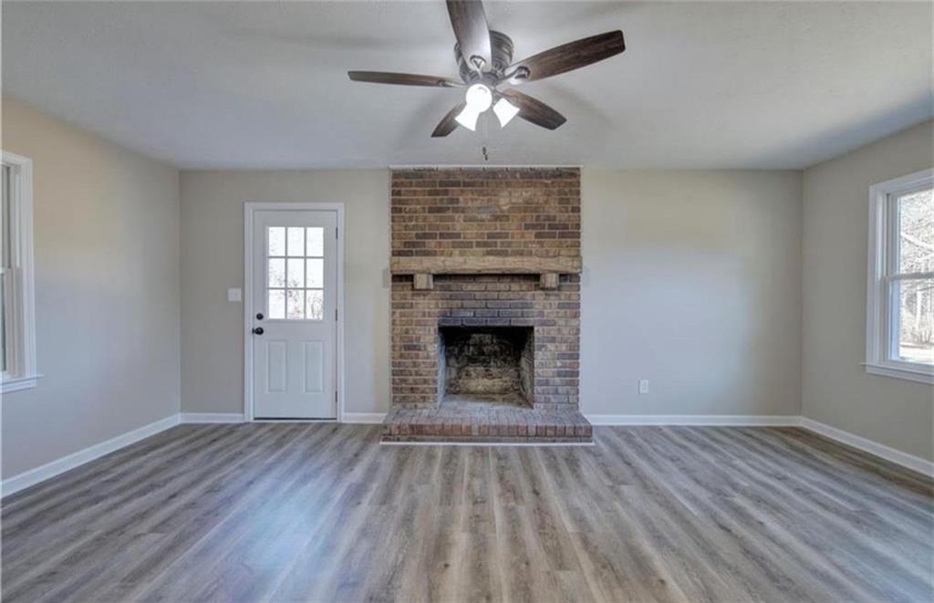3002 Jennings Court Powder Springs, GA 30127 - Photo 6 of 47 a view of empty room with wooden floor and fan