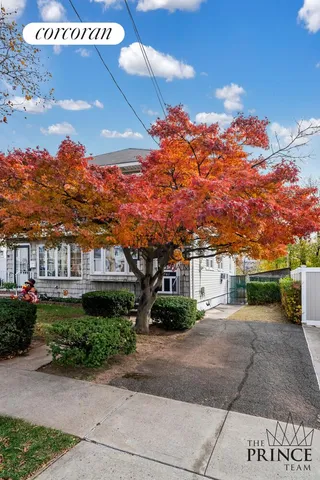 a view of a street with a building in the background