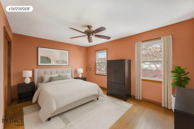 a bedroom with a large bed and a chandelier