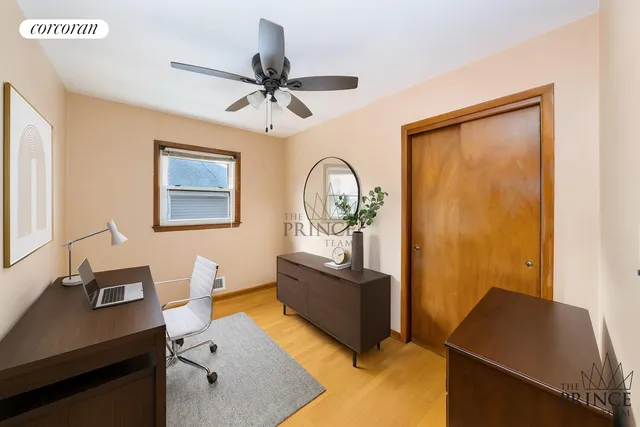 a view of workspace with wooden floor and ceiling fan